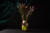 Vase with flowers on a dark background
