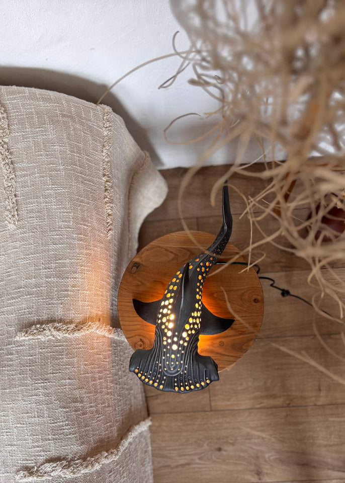 Decorative lamp with geometric design on a textured surface