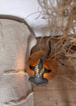 Decorative lamp with geometric design on a textured surface