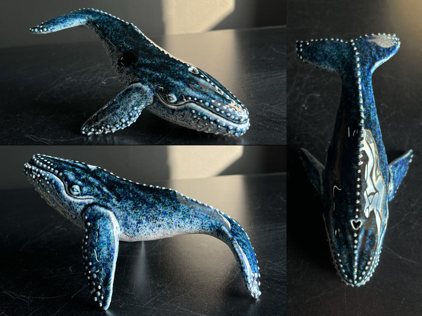 Collage of a blue whale figurine on a dark surface