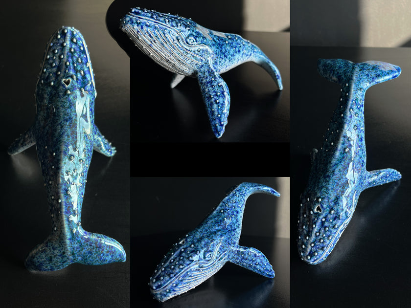 Collage of a blue whale figurine on a black background