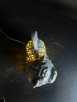 Decorative object with a glowing interior on a dark surface